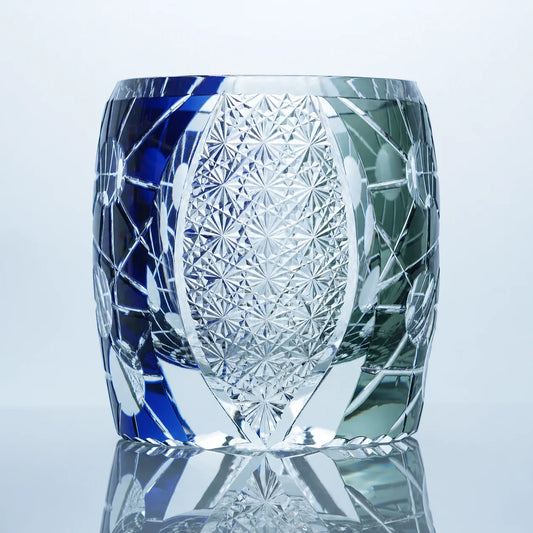 Blue black Edo Kiriko whiskey glass with hand-cut crystal patterns and a clear star-cut center panel.