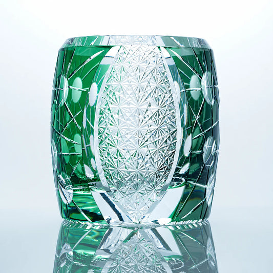 Green black Edo Kiriko whiskey glass with hand-cut crystal patterns and a clear star-cut center panel.