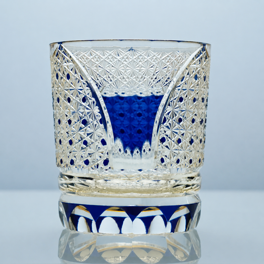 Sapphire Arc Edo Kiriko whiskey glass with blue accents, golden details, and hand-cut starburst crystal patterns.