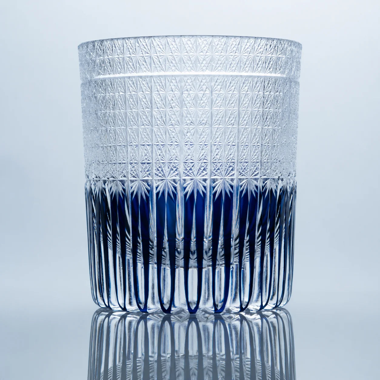 Shion Purple Edo Kiriko whiskey glass with hand-cut crystal star patterns and deep indigo-purple vertical cuts.