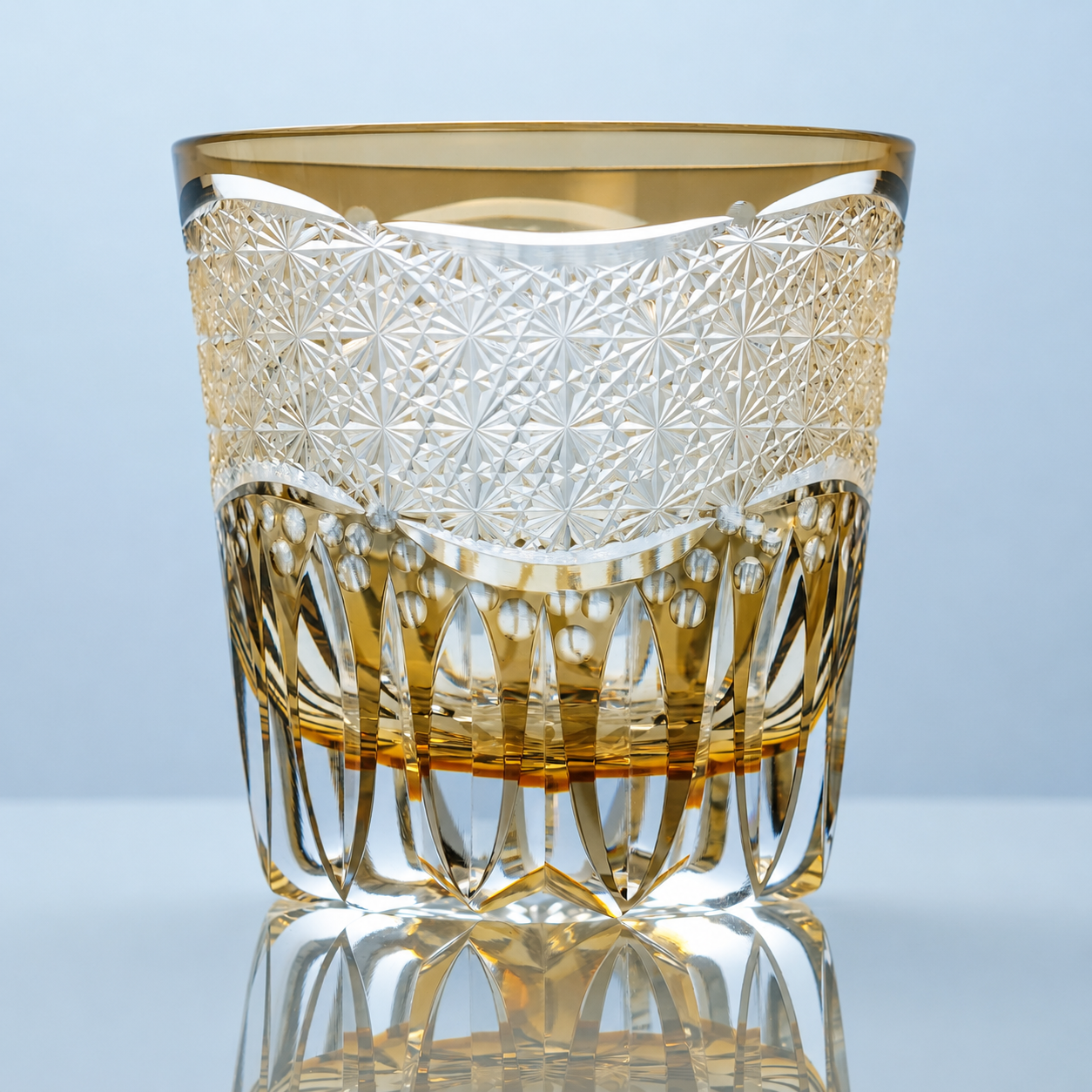 Golden Cascade Edo Kiriko whiskey glass with intricate starburst patterns and champagne-gold crystal detailing.