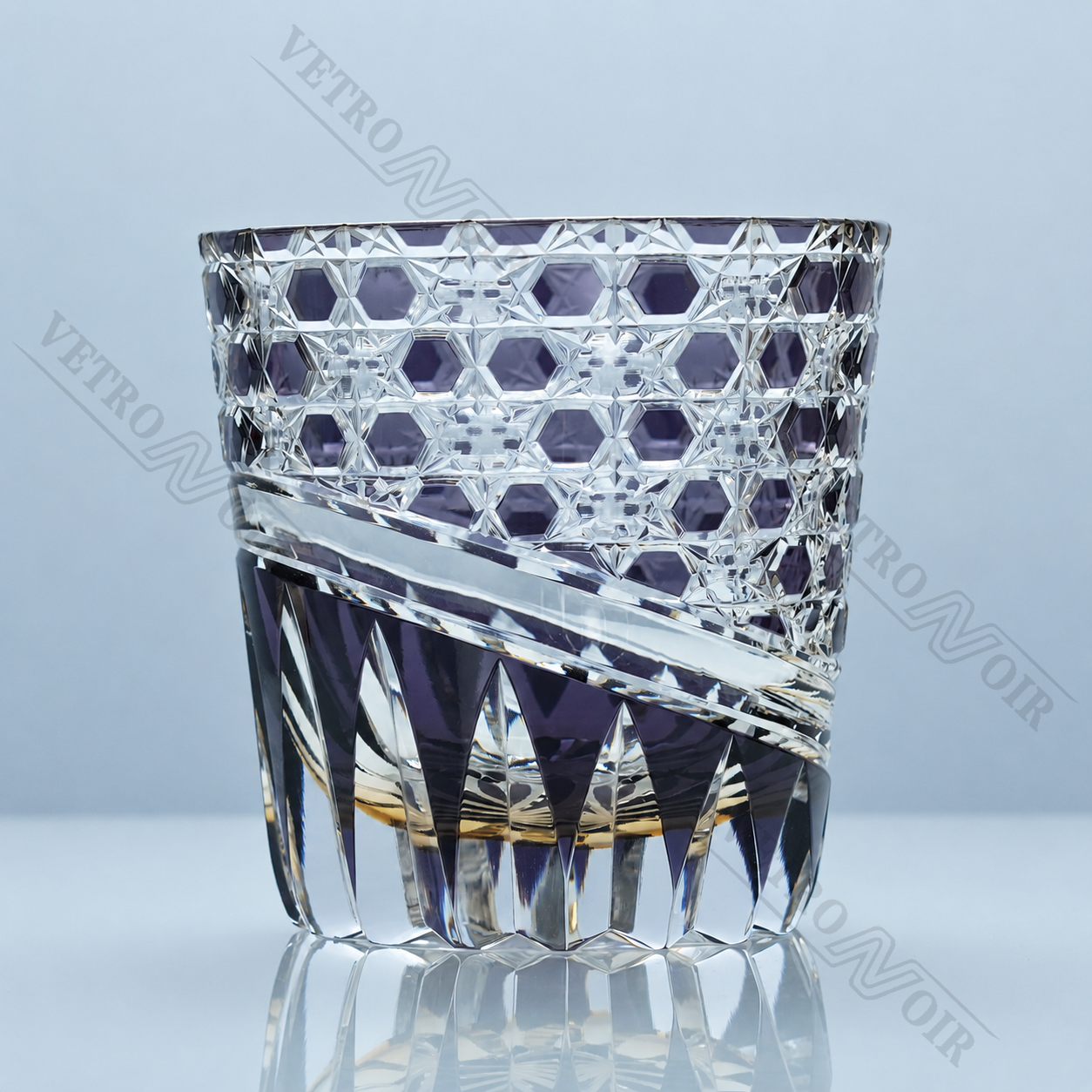 Shop the Amethyst Hexa Prism Edo Kiriko whiskey glass, a hand-cut crystal tumbler with purple tones, hexagonal cuts, prism facets, and a starburst base.